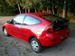 Mazda 323 sprzedam czerwony 4600 PLN cena do negocjacji Tkanina pierwszy właściciel 2-drzwiowy Toruń